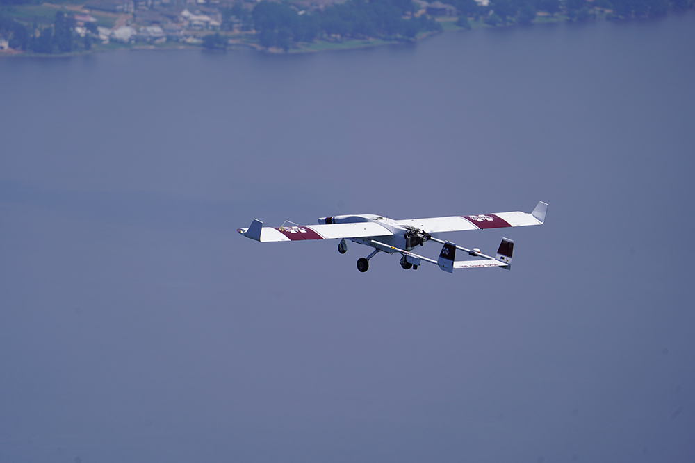 A TigerShark UAS flies over the Pearl River