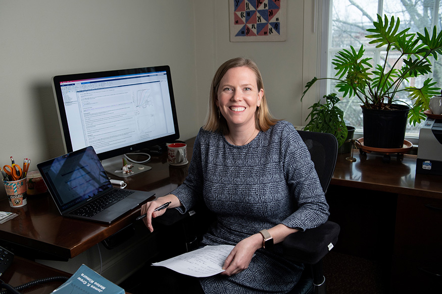 Portrait of Amy Dapper at her desk