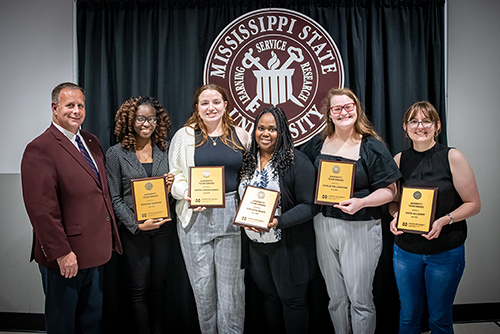 Left to Right: The MSU Pipetting Team Kenisha Gordon, also winner of the CALS/NACTA Graduate Student Teaching Award of Merit and the CALS/MAFES Individual Diversity Award; Sarah Broadaway; Faculty Advisor Shecoya White; Carlie Willingham and Katie Allgaier. Not pictured: Christina Istiphan. (Photo by David Ammon)