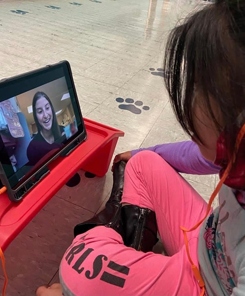 An English Learner student in Scott County interacts with an MSU preservice teacher on a computer screen.