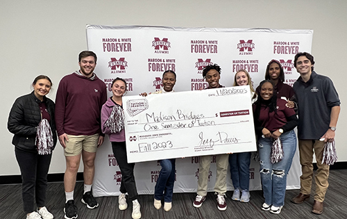 Tuition drawing winner Madison Bridges (fourth from right) is surrounded by members of the MSU Alumni Delegates organization. Bridges, a freshman business administration major from Grenada, will receive free, full-time tuition for the spring semester.