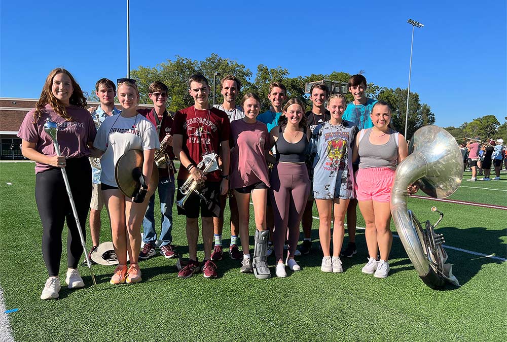 Seven sets of siblings (minus one not pictured) are part of this year's Famous Maroon Band at MSU, shown in a group photo at a practice session.