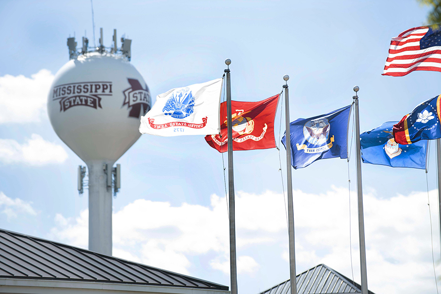 Military, U.S. and Mississippi flags fly on the MSU campus.