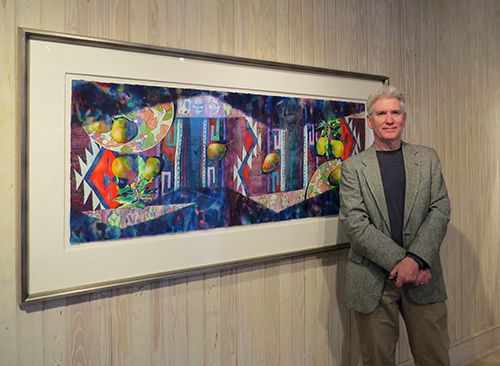 Mississippi State University William L. Giles Distinguished Professor of Art Brent Funderburk stands with one of his award-winning watercolor paintings, “Oaxaca.” Funderburk is retiring this May after nearly 36 years at MSU. (Photo submitted)