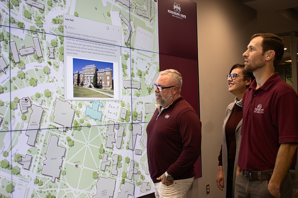 GRI researchers look at the MSU map on a large screen
