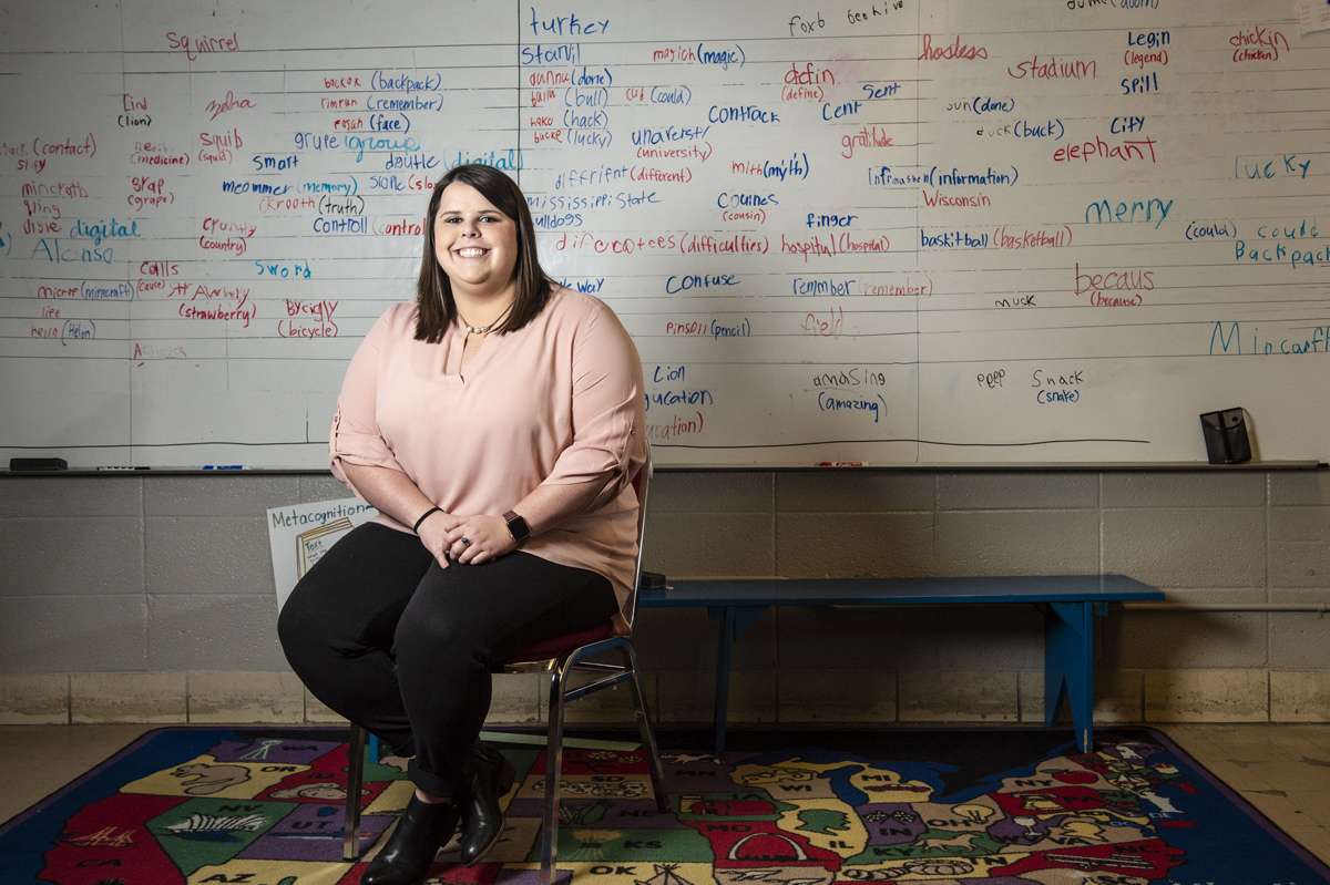 Mary Helon Hays, pictured in front of a classroom whiteboard.