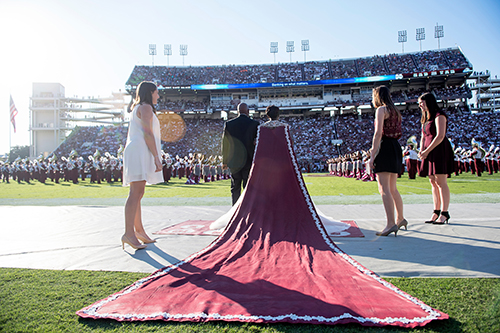 Homecoming Queen Shawanda Brooks stands in front of packed crowd at Davis Wade Stadium.