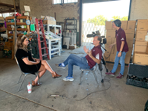 MSU Television Center Director David Garraway, sitting, and Senior Producer James Parker interview non-profit Extra Table Executive Director Martha Allen during filming for “The Hungriest State” documentary series. 
