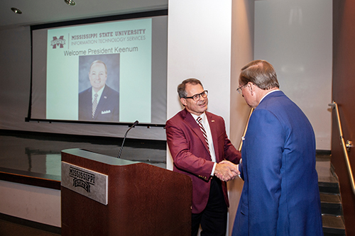 Steve Parrott welcomes Mark E. Keenum to the podium