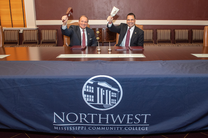 Mark Keenum and Michael Heindl sign an MOU at Mississippi State.