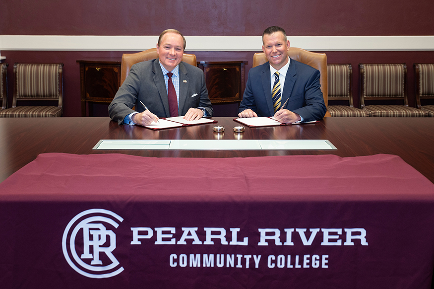 Mark Keenum and Adam Breerwood sign and MOU at Mississippi State