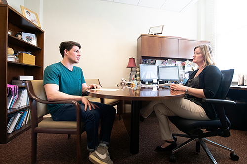 MSU student Reed Bigham meeting with MSU faculty member Mary Celeste Reese 