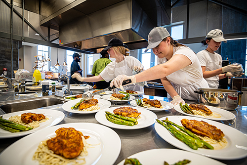 Mississippi State College of Agriculture and Life Sciences food science students prepare a meal.