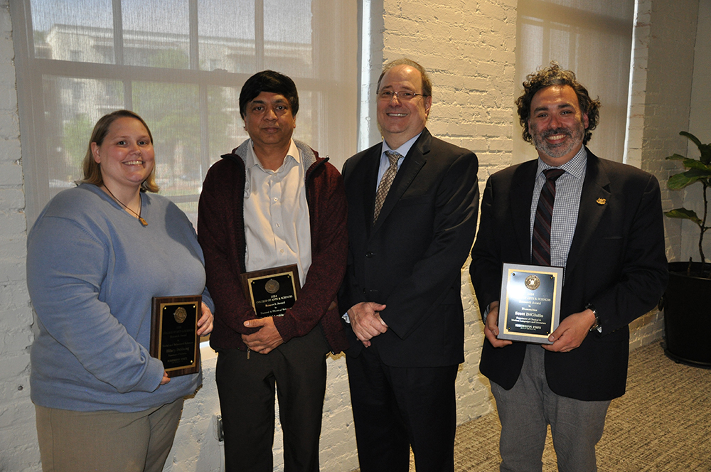 Pictured are MSU College of Arts and Sciences Dean Rick Travis, second from right, and, from left, 2024 MSU College of Arts and Sciences’ Research Award recipients Hillary DeShong, Department of Psychology assistant professor; Shrinidhi Ambinakudige, Department of Geosciences assistant professor; and Scott DiGiulio, Department of Classical and Modern Languages and Literatures associate professor.