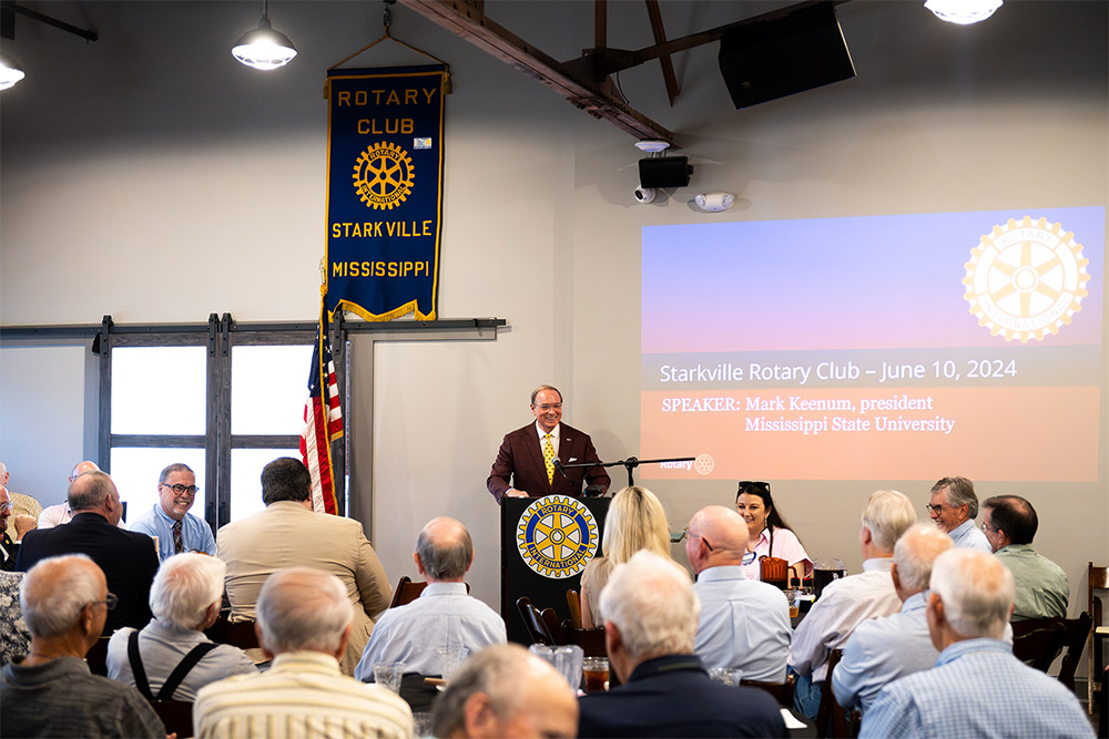 Keenum speaking at the Rotary Club podium