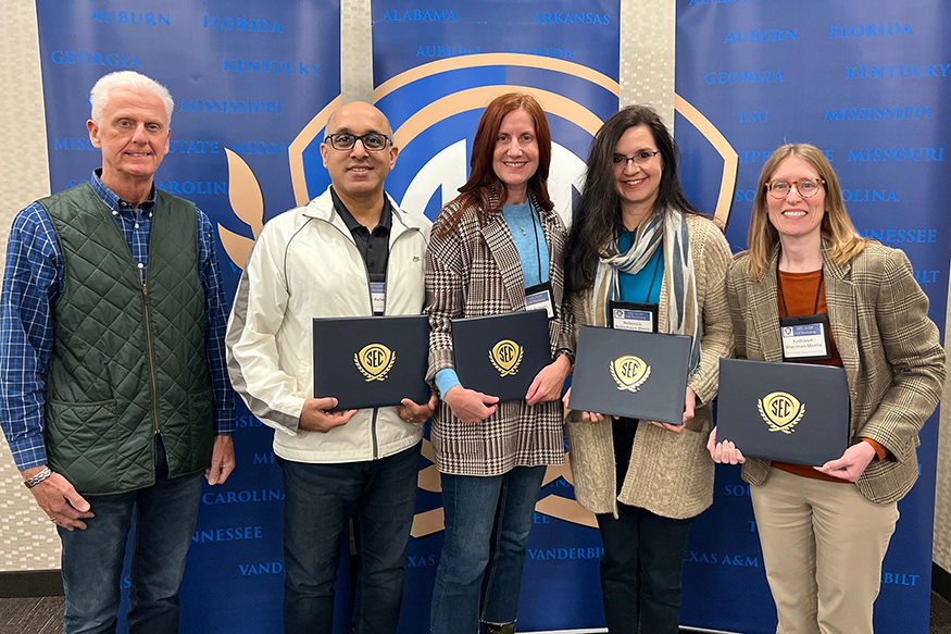 Peter Ryan, Sharahm Rahimi, Ashli Brown, Rebecca Roubicheaux Davis and Kathleen Sherman-Morris in a group picture.