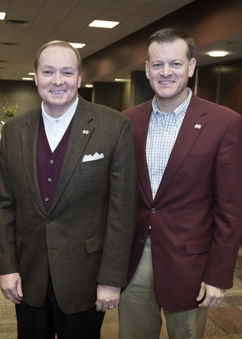 MSU President Mark E. Keenum, left, pictured with Scott Stricklin. Keenum today announced a nationwide search to choose the institution’s 17th director of athletics to replace Stricklin, who has accepted the athletic director’s job at the University of Florida. (Photo by Megan Bean)