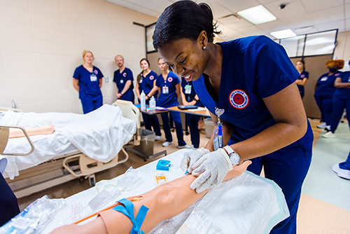 Nursing students learn skills in a UMMC School of Nursing lab