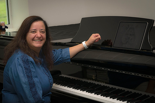 MSU Professor of Music and Steinway Artist Rosângela Sebba is pictured with the university’s new Steinway SPIRIO|r, housed in the new Music Building’s Lecture-Recital Hall. 