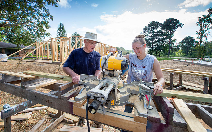 An MSU student volunteers alongside a community member as part of the annual Maroon Edition project in partnership with Starkville Area Habitat for Humanity. 