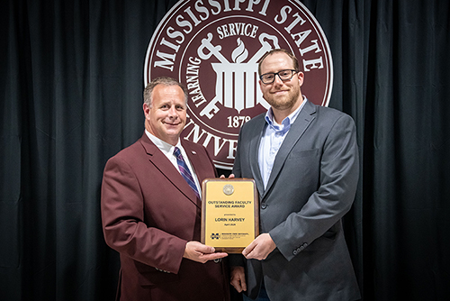 Left to Right: CALS Dean and MAFES Director Scott Willard with Assistant Professor Lorin Harvey, Department of Plant and soil Sciences, winner of the CALS/MAFES Faculty Service Award. (Photo by David Ammon)
