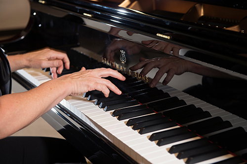 Person playing on a Steinway piano