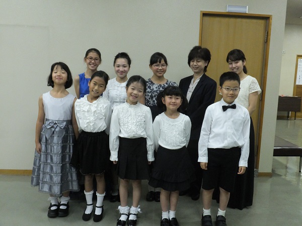 The Starkville-MSU Symphony Orchestra is presenting a “Strings Across the Sea” children’s program at historic Lee Hall’s Bettersworth Auditorium on the Starkville campus. The concert will feature eight visiting Japanese violinists, pictured here with their conductor and conductor’s assistant (back row, far right). (Photo submitted)