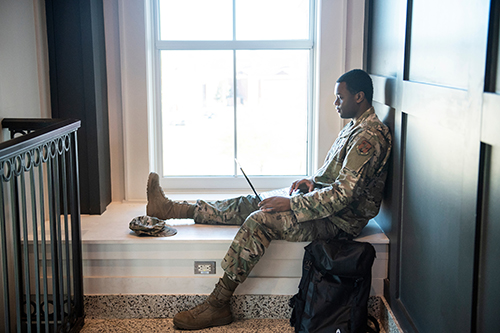 An Air Force ROTC student studies with a laptop computer
