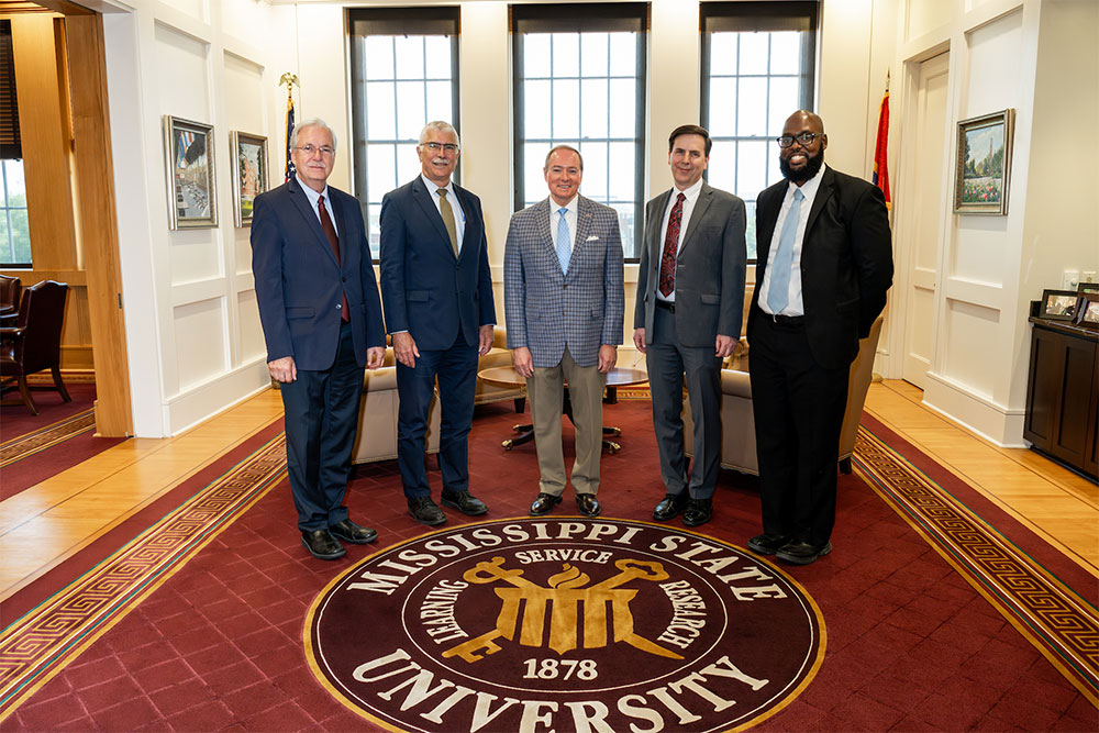 While on campus to celebrate the Feed the Future Innovation Lab for Fish, special guests met with several MSU leaders and toured multiple research centers. Pictured from left, Special Representative of the Director-General at FAO Daniel Gustafson, USAID Chief Scientist Robert Bertram, MSU President Mark E. Keenum, Fish Innovation Lab Director Mark Lawrence, and USAID Agricultural Development Officer Tyrell Kahan met to discuss international development and how MSU can continue to make a positive impact in food insecurity. 