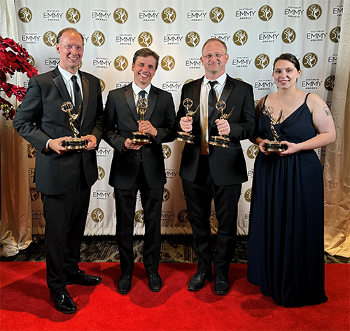 From left, UTC Director and OPA Associate Director David Garraway; Senior Documentary and Special Projects Producer James Parker; Creative Manager Hal Teasler; and Video Producer Olivia Aylsworth pictured with multiple Emmy Awards at the recent National Academy of Television Arts and Sciences-Southeast Chapter awards ceremony. 