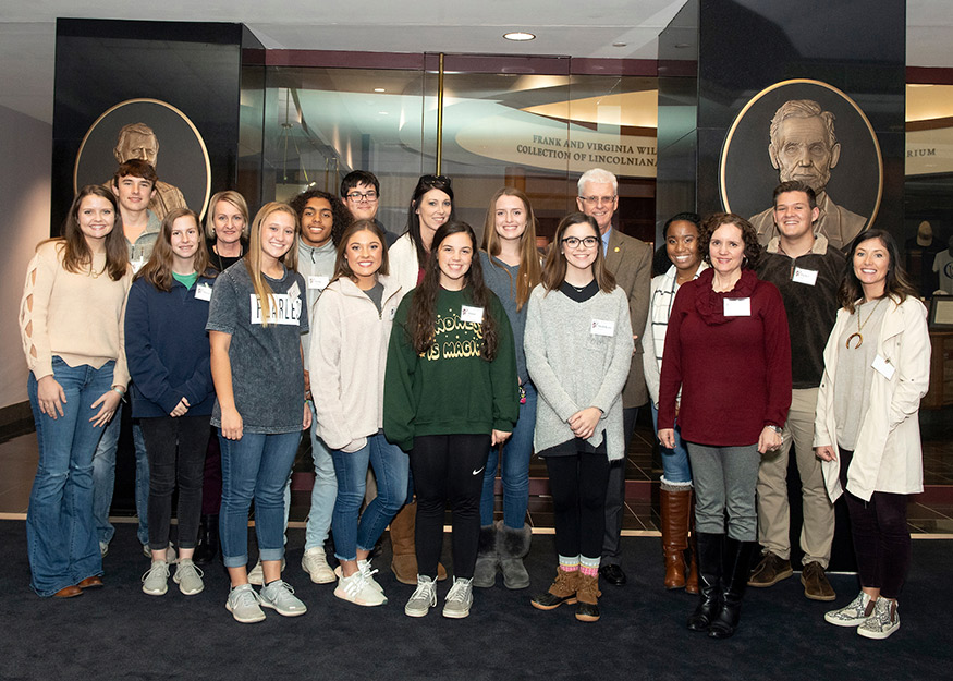 Pictured from left are Bailey Brown and Garret Womack of East Webster High School; Morgan Gray of Philadelphia High School; Kosciusko High School librarian Katrina Overstreet; Kylie Richardson of Eupora High School; Jariq Stribling of PHS; Katelyn Boatman of EHS; Carter Elliott of Jackson Academy; EHS librarian Cala Tabb; Alana Hunter of EHS; Abbey McCrory of KHS; MolliKate Keehley of EWHS; MSU Associate Provost for Academic Affairs Peter Ryan; Karla Nash of KHS; JA librarian Bronwyn Burford; Parker Jones of KHS; and EWHS librarian Christy Sisson. (Photo by Beth Wynn)