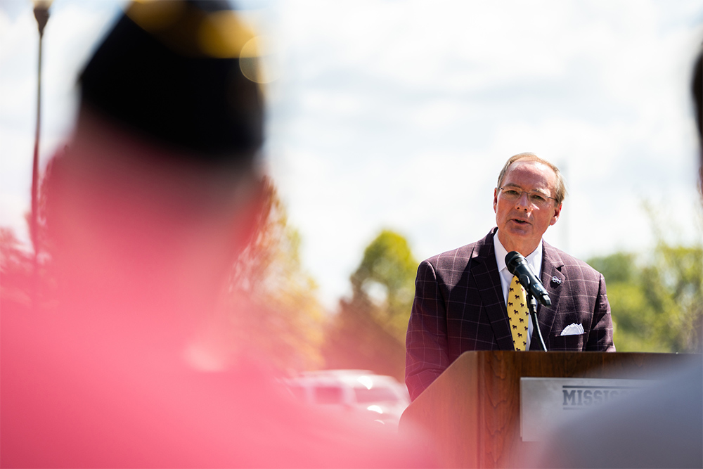 MSU President Mark E. Keenum speaks at an unveiling ceremony for the university's new WWII monument
