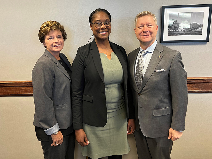 Rita Potts Parks and Bart Williams pictured with Erika Womack following her confirmation by the Senate