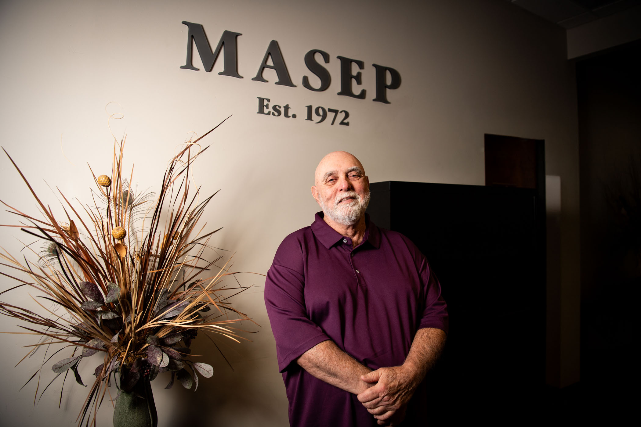 man in front of sign