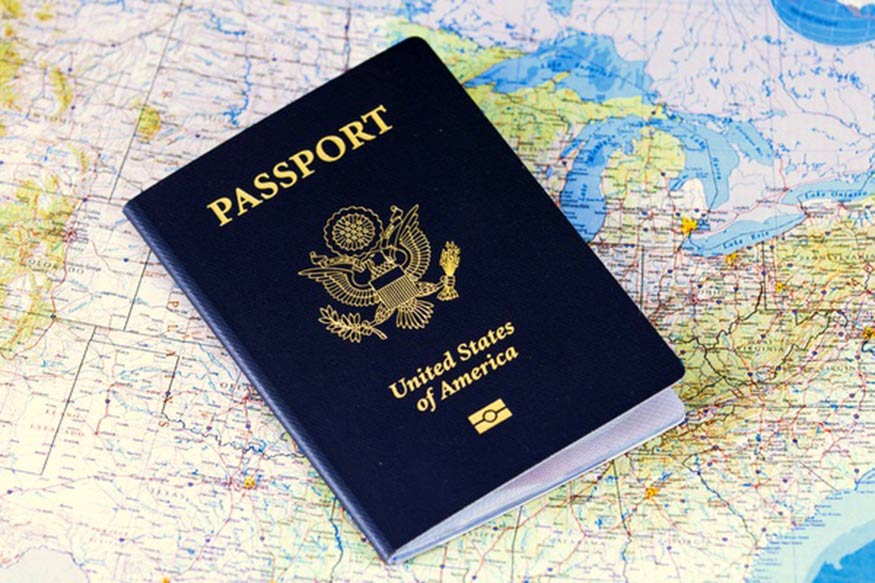 A passport sitting on top of a map