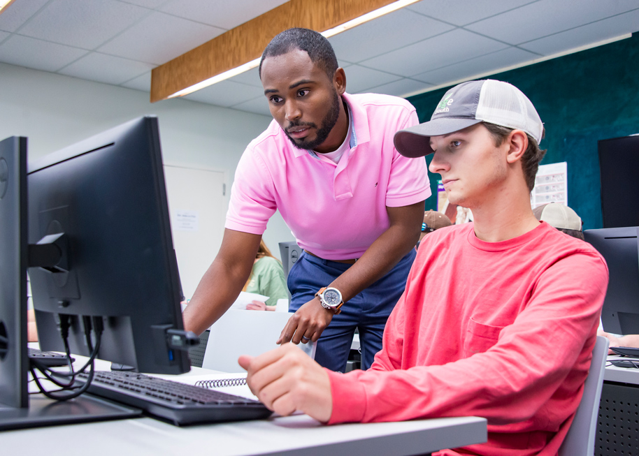 MSU instructor T.J. Bradford (left) works with senior agronomy major John Clay Lyles of Lawrence in the College of Agriculture and Life Sciences’ new Precision Agriculture Laboratory in Dorman Hall. (Photo by David Ammon)