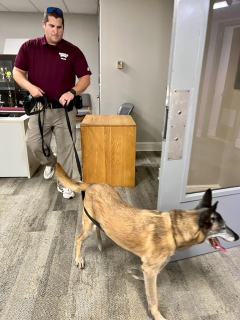 An MSU Police officer and specially trained K-9.