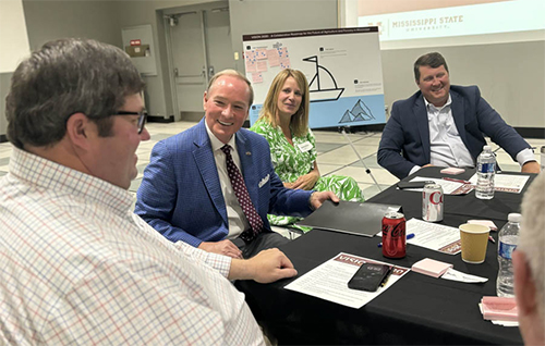 MSU President Mark E. Keenum visits with Delta Council President Bubba Simmons, Director of the Bureau of Plant Industry Laura Vollor, and National Affairs Coordinator for Mississippi Farm Bureau Justin Ferguson following his keynote address at today’s [June 12] launch of Vision 2030. 