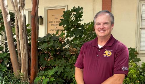 Photo of Chance David in front of the Stennis Institute. 