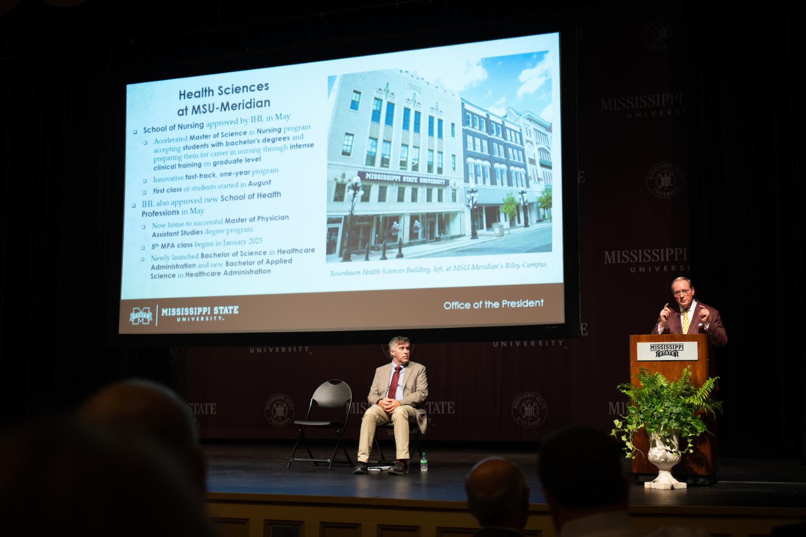 Mississippi State President Mark E. Keenum stands at a podium and gives remarks during the 2024 Fall General Faculty Meeting.