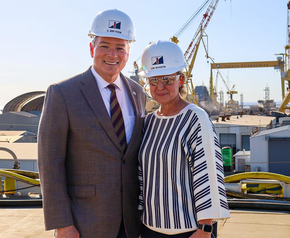 MSU President Mark E. Keenum and Huntington Ingalls Executive Vice President and Ingalls Shipbuilding President Kari Wilkinson overlook the shipyard at Ingalls Shipbuilding, a division of Huntington Ingalls Inc.