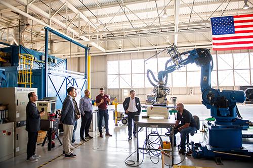 Mississippi State representatives lead a tour of the university’s Advanced Composites Institute.