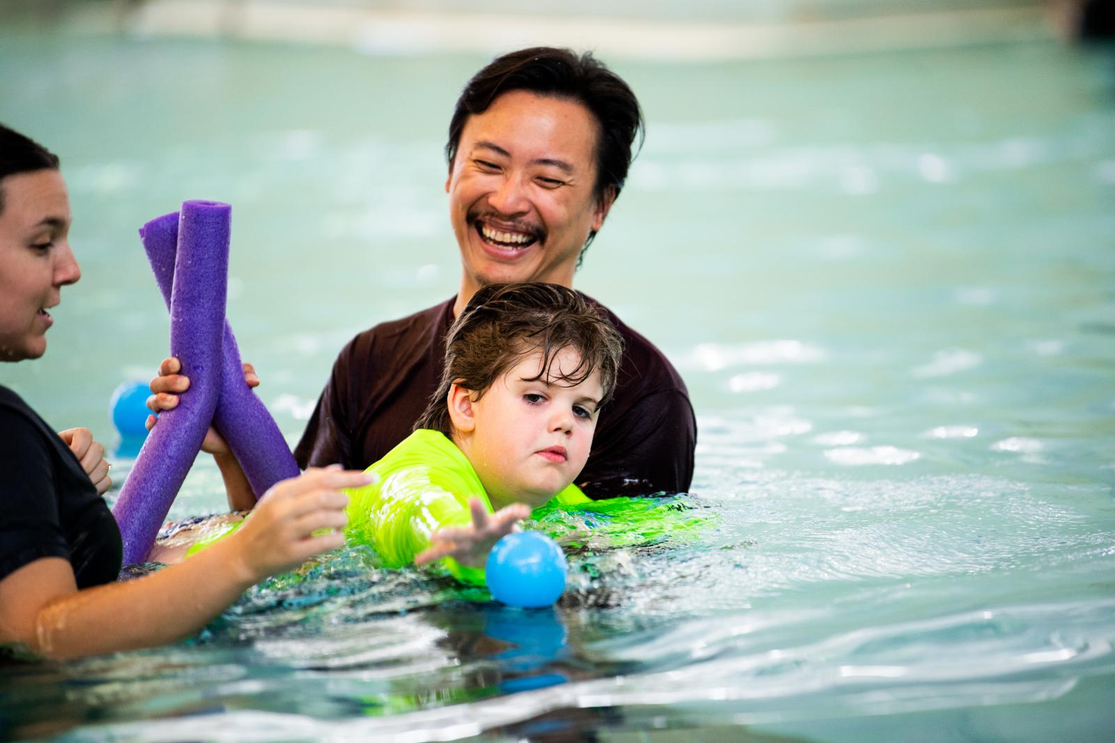 child swimming in water