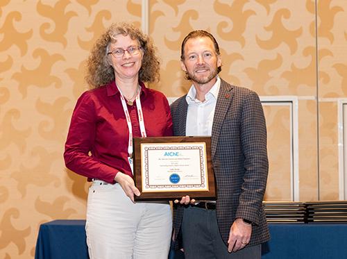 Julie Jessop receives last year’s Outstanding Student Chapter Advisor Award.