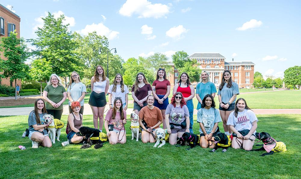 MSU Puppies with a Purpose members and puppies on the Drill Field
