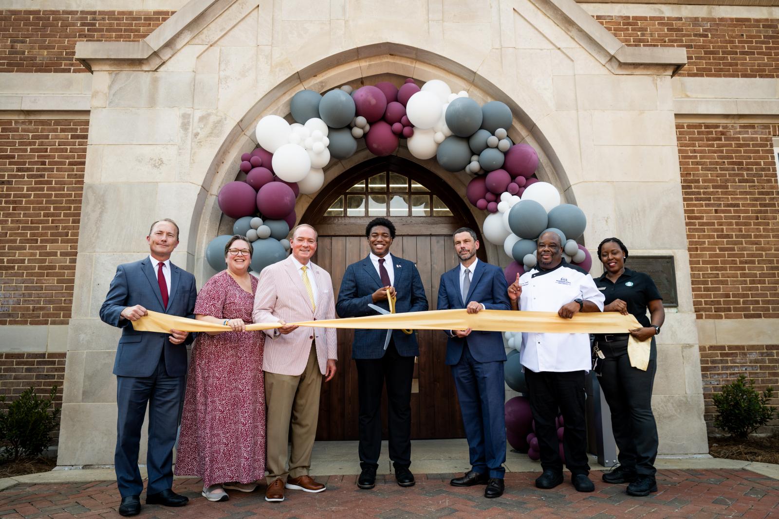 MSU admin in front of perry for ribbon cutting