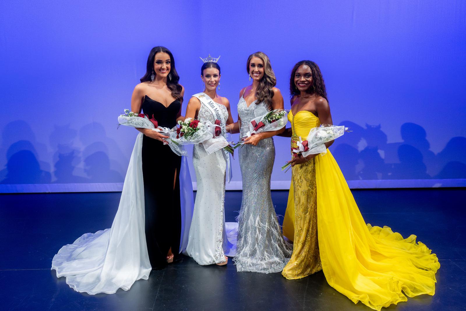 three young women in ballgowns