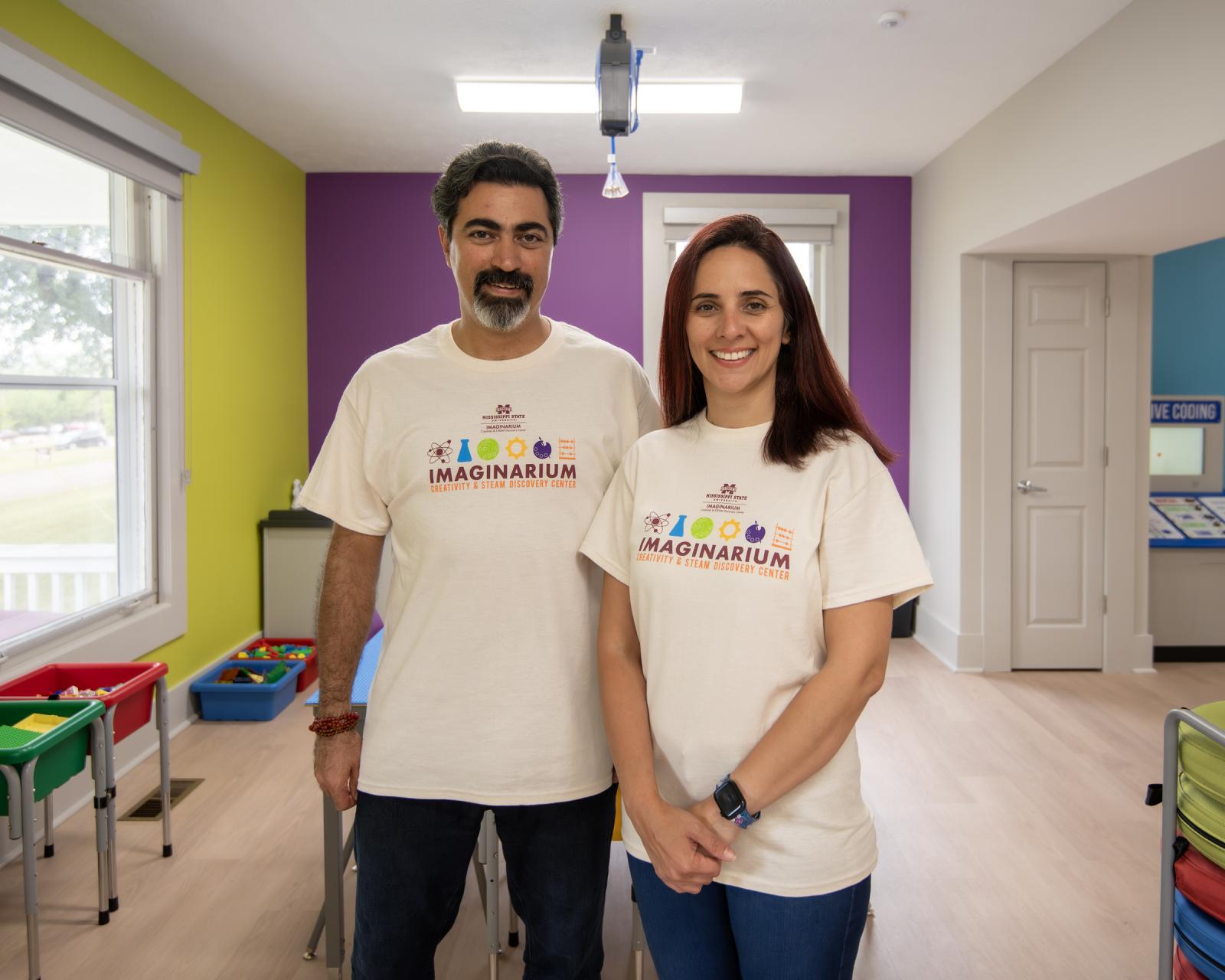 man and woman in colorful room