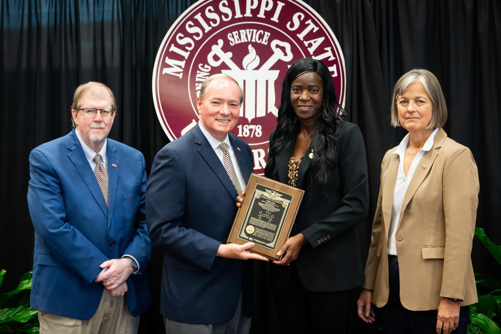 Vice President for DAFVM Keith Coble, MSU President Mark E. Keenum, Associate Professor Colleen Scott, and Vice President for Research and Economic Development Julie Jordan