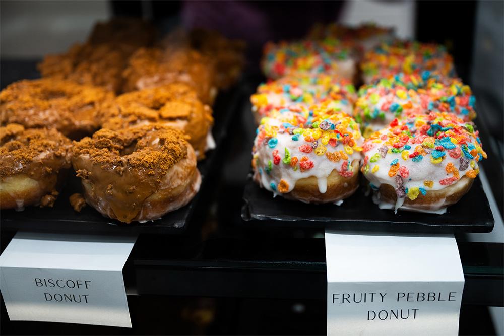 Donuts in a pastry case at the State Fountain Bakery